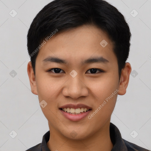 Joyful asian young-adult male with short  black hair and brown eyes