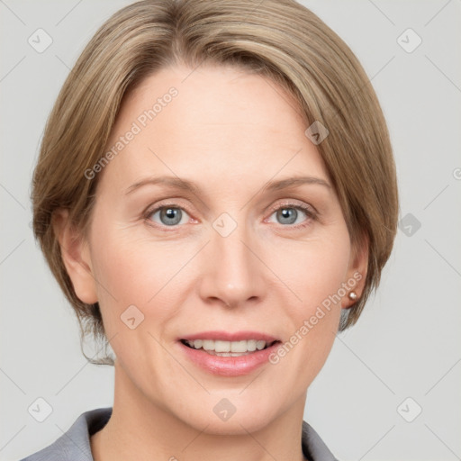 Joyful white adult female with medium  brown hair and blue eyes