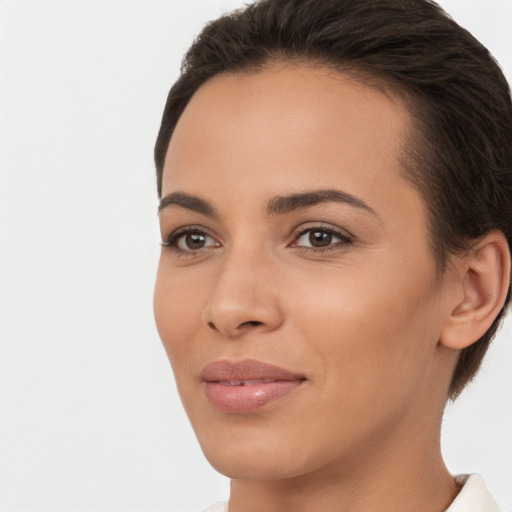 Joyful white young-adult female with short  brown hair and brown eyes