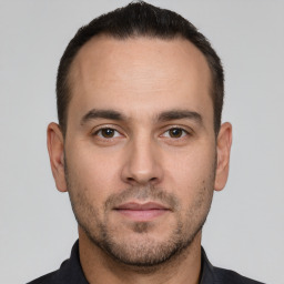 Neutral white young-adult male with short  brown hair and brown eyes