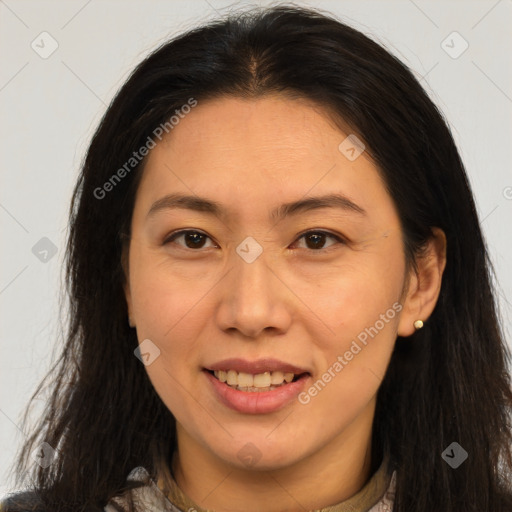 Joyful white adult female with long  brown hair and brown eyes