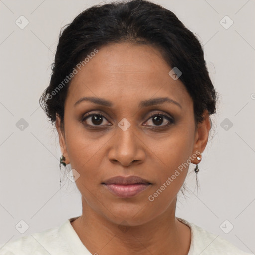 Joyful black adult female with short  brown hair and brown eyes