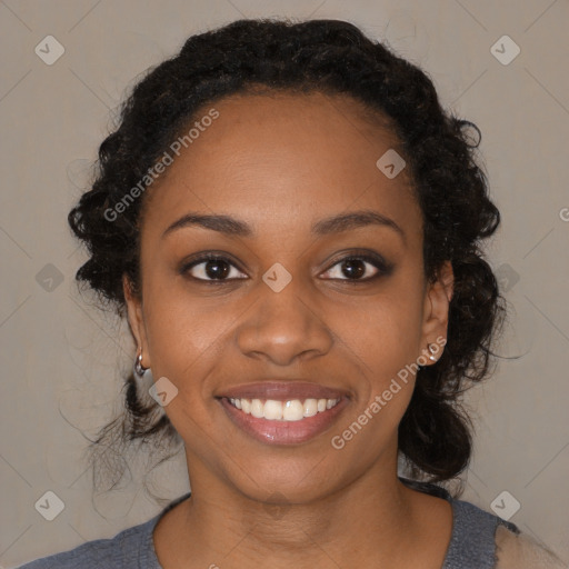 Joyful black young-adult female with medium  black hair and brown eyes