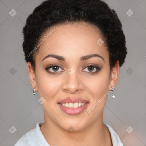 Joyful black young-adult female with short  black hair and brown eyes