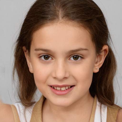 Joyful white child female with medium  brown hair and brown eyes