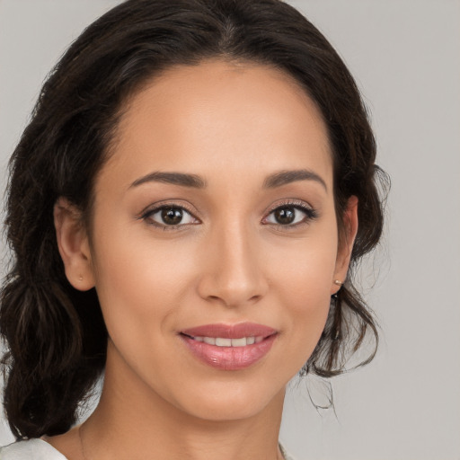 Joyful white young-adult female with medium  brown hair and brown eyes