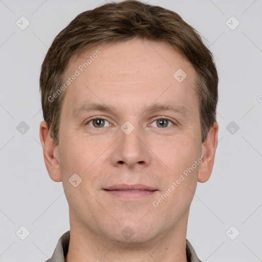 Joyful white adult male with short  brown hair and grey eyes