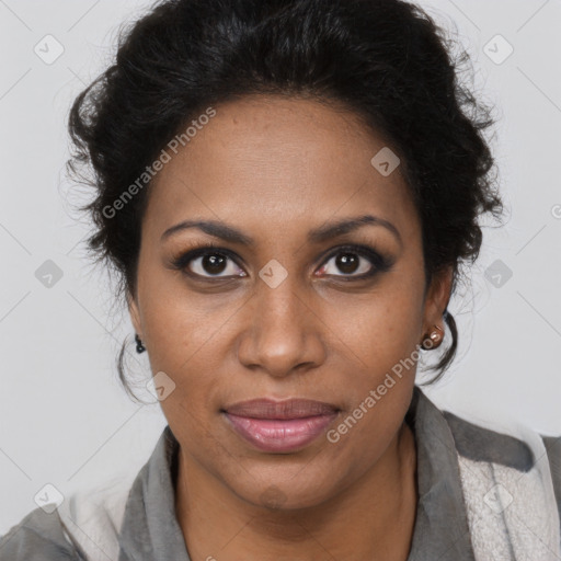 Joyful black adult female with medium  brown hair and brown eyes