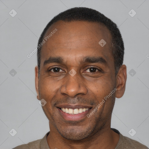 Joyful latino adult male with short  black hair and brown eyes