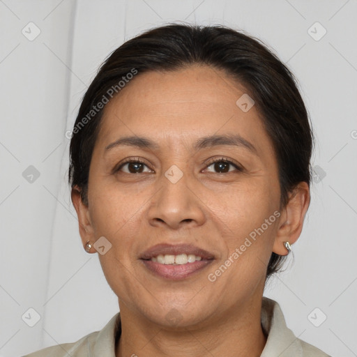 Joyful white adult female with short  brown hair and brown eyes