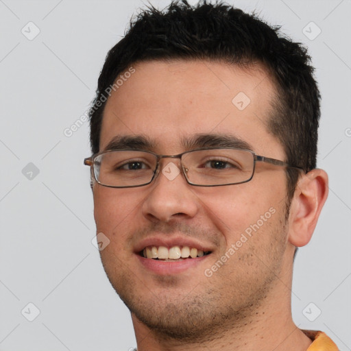 Joyful white young-adult male with short  black hair and brown eyes