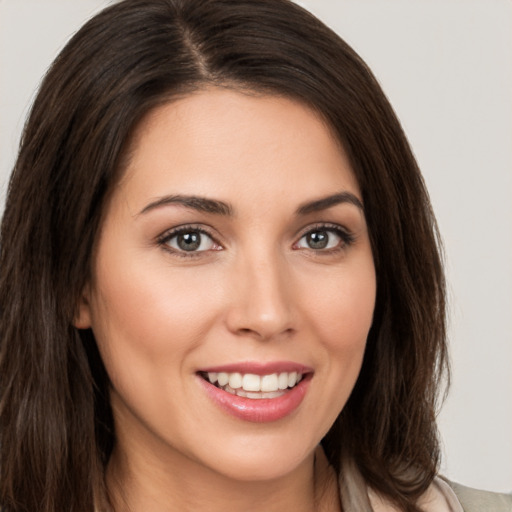 Joyful white young-adult female with medium  brown hair and brown eyes