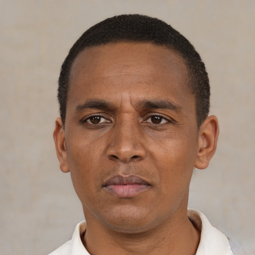 Neutral black adult male with short  black hair and brown eyes