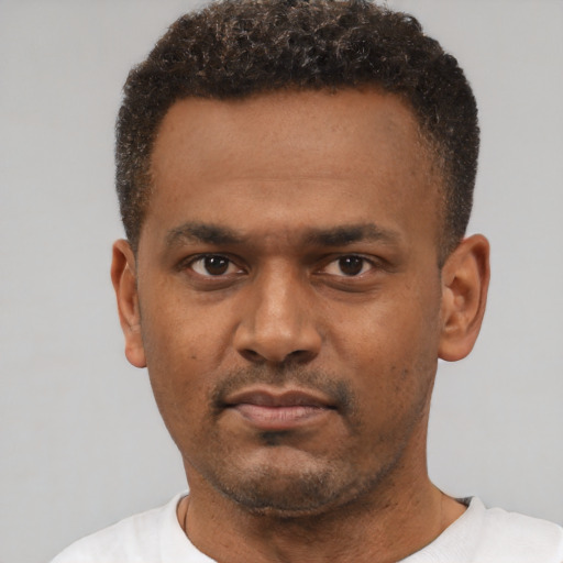Neutral black young-adult male with short  black hair and brown eyes