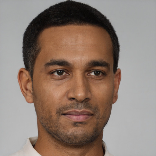 Neutral latino young-adult male with short  brown hair and brown eyes