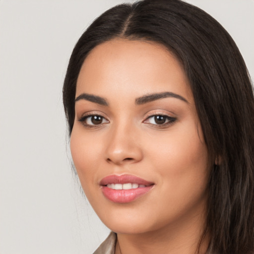 Joyful white young-adult female with long  black hair and brown eyes