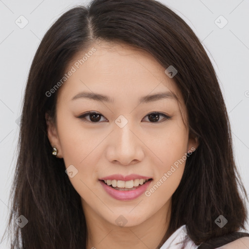 Joyful asian young-adult female with long  brown hair and brown eyes