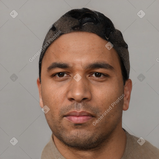 Neutral latino young-adult male with short  black hair and brown eyes