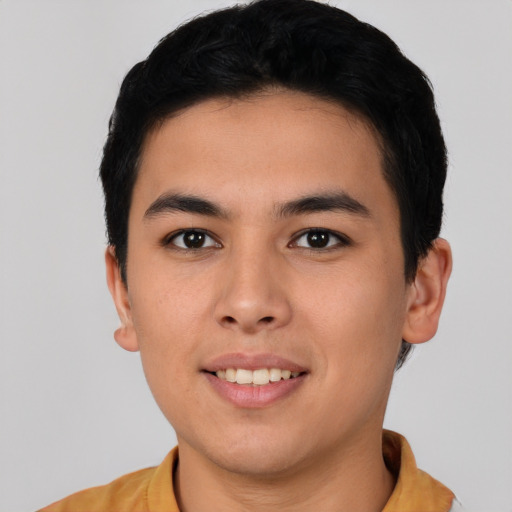 Joyful asian young-adult male with short  brown hair and brown eyes
