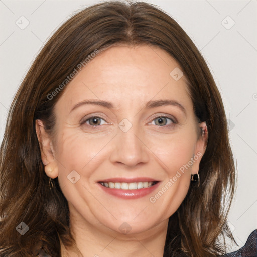 Joyful white adult female with medium  brown hair and grey eyes