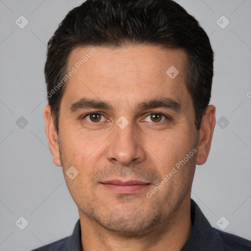 Joyful white adult male with short  brown hair and brown eyes