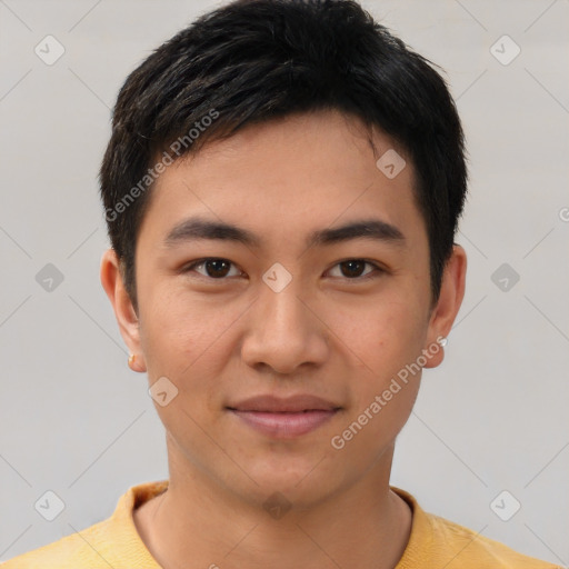 Joyful asian young-adult male with short  brown hair and brown eyes