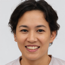 Joyful asian young-adult female with short  brown hair and brown eyes