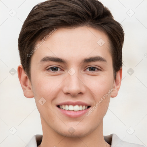 Joyful white young-adult male with short  brown hair and brown eyes