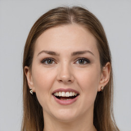 Joyful white young-adult female with long  brown hair and grey eyes