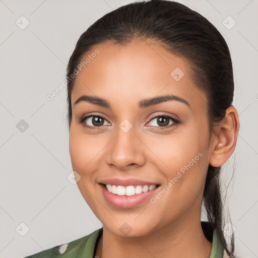 Joyful white young-adult female with long  brown hair and brown eyes