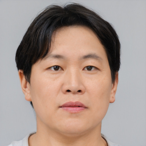 Neutral asian young-adult male with short  brown hair and brown eyes