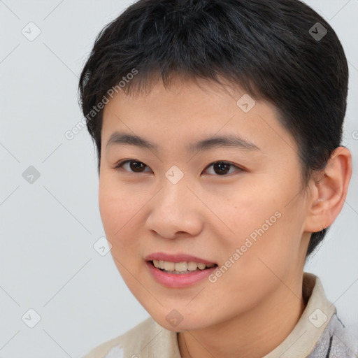 Joyful asian young-adult female with short  brown hair and brown eyes