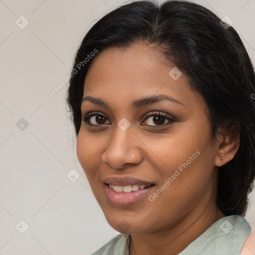 Joyful latino young-adult female with medium  brown hair and brown eyes