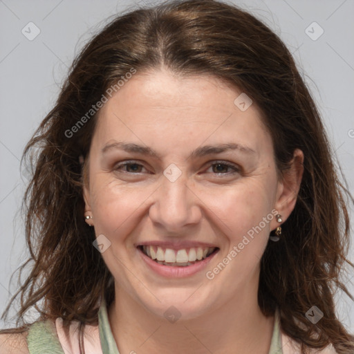 Joyful white adult female with medium  brown hair and brown eyes