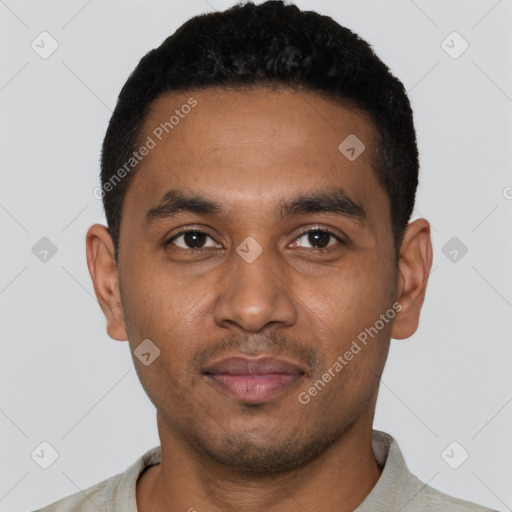 Joyful black young-adult male with short  black hair and brown eyes