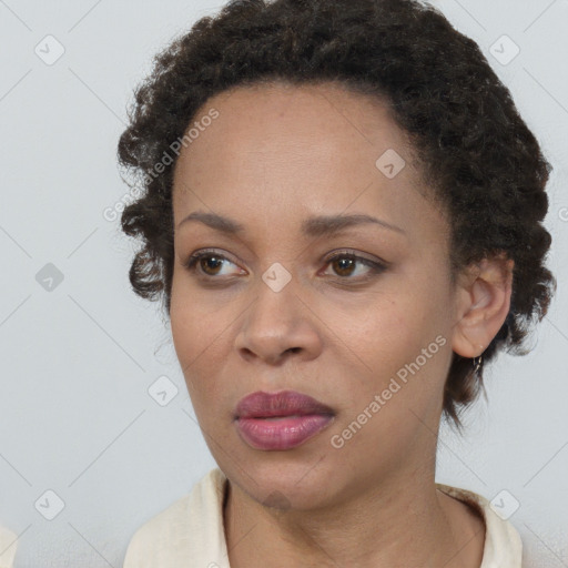 Neutral black young-adult female with short  brown hair and brown eyes