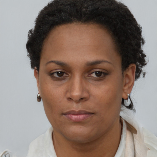 Neutral black adult female with short  brown hair and brown eyes