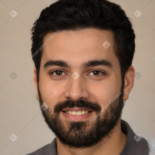 Joyful white young-adult male with short  black hair and brown eyes