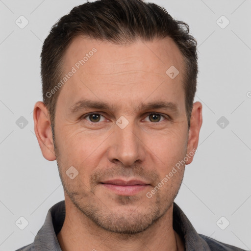 Joyful white adult male with short  brown hair and brown eyes