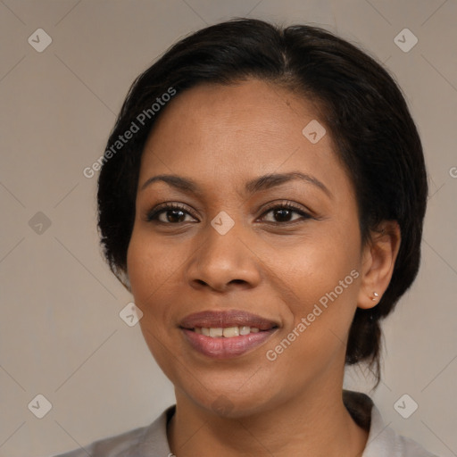 Joyful black adult female with medium  brown hair and brown eyes