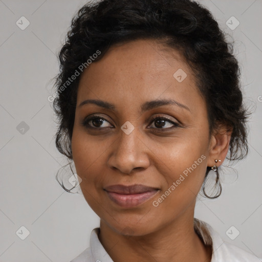 Joyful black young-adult female with medium  brown hair and brown eyes