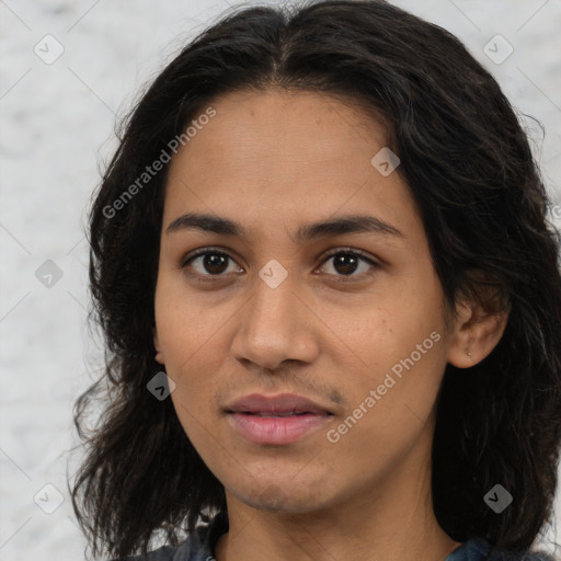 Joyful latino young-adult female with long  brown hair and brown eyes