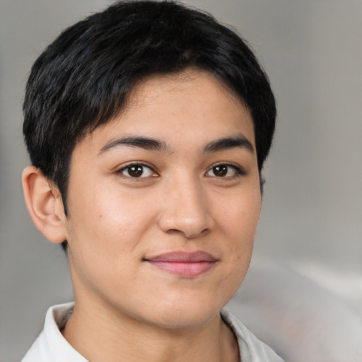 Joyful latino young-adult female with short  brown hair and brown eyes