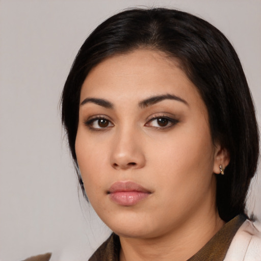 Neutral latino young-adult female with medium  black hair and brown eyes