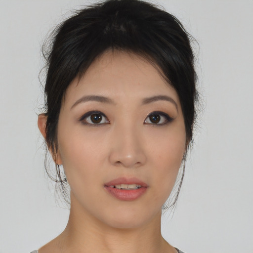 Neutral asian young-adult female with medium  brown hair and brown eyes