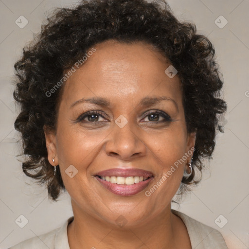 Joyful black adult female with medium  brown hair and brown eyes