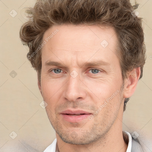 Joyful white adult male with short  brown hair and grey eyes