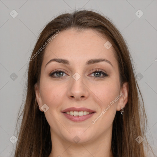 Joyful white young-adult female with long  brown hair and grey eyes