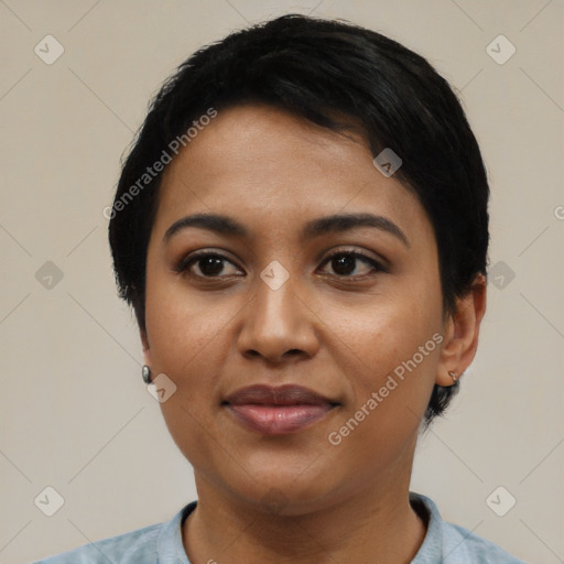 Joyful latino young-adult female with short  black hair and brown eyes