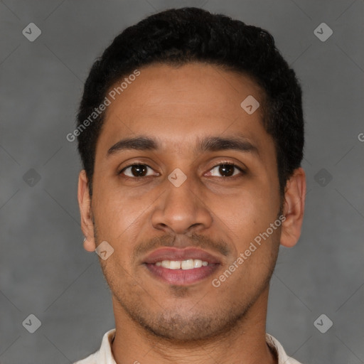 Joyful latino young-adult male with short  black hair and brown eyes